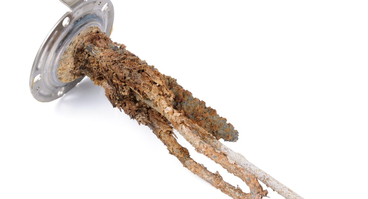 heating element of water heater with scum and sediment isolated on white background