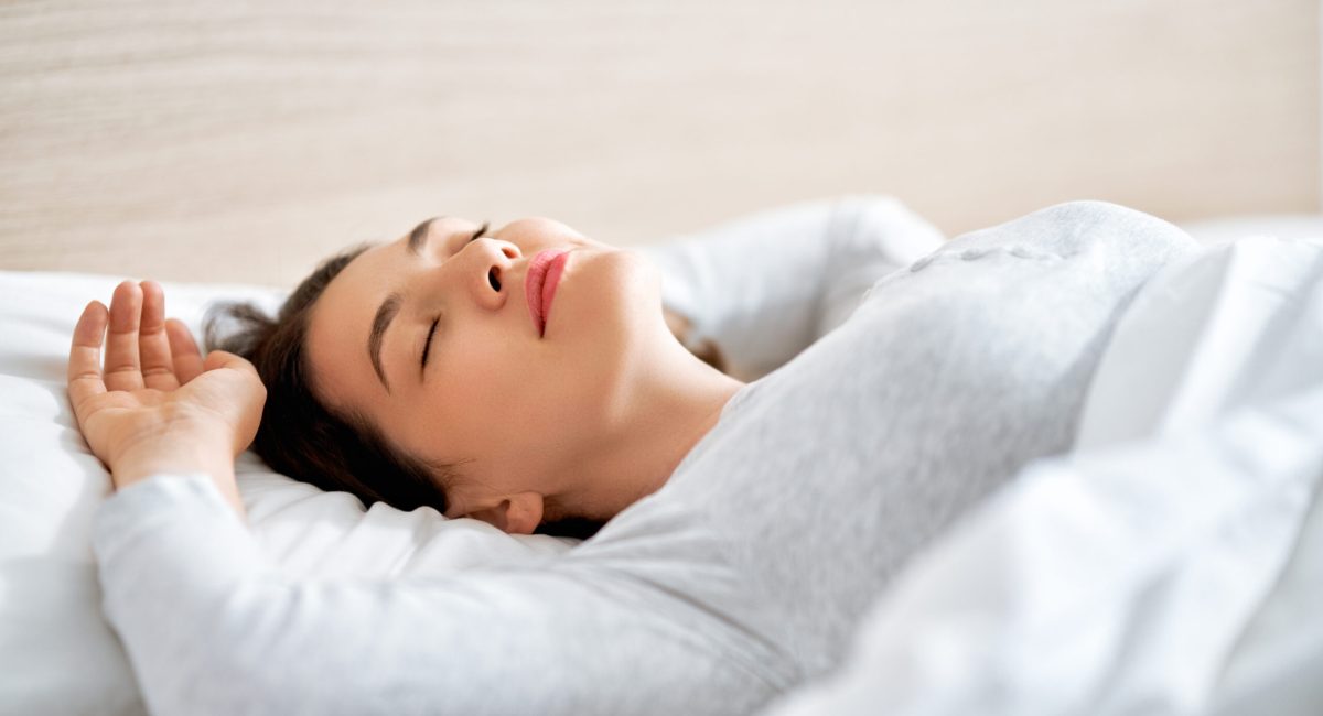 beautiful young woman is sleeping in the bedroom