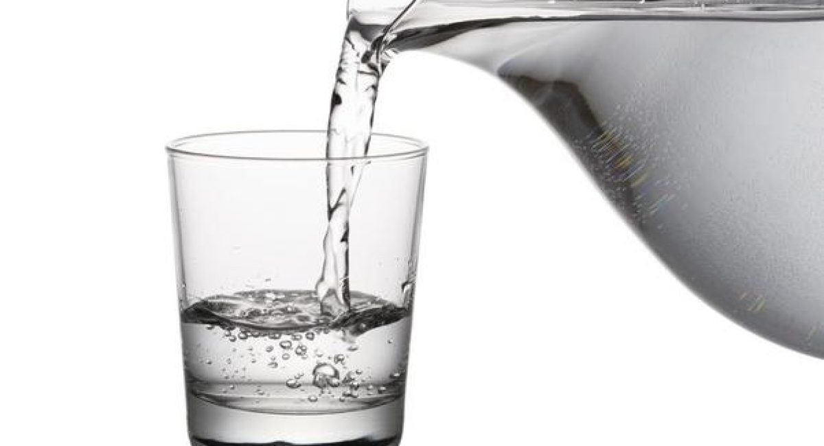 Clean water being poured in glass - Filter Drinking Water concept image